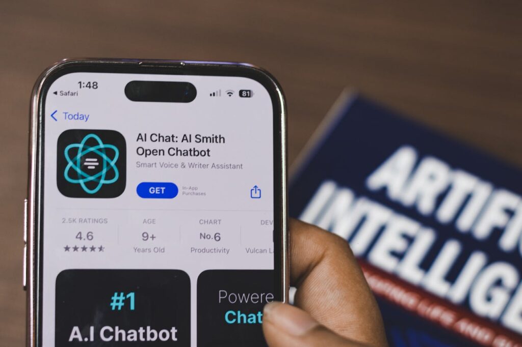 Crafting Captivating Headlines: Your awesome post title goes here Hand holding a smartphone with AI chatbot app, emphasizing artificial intelligence and technology.
